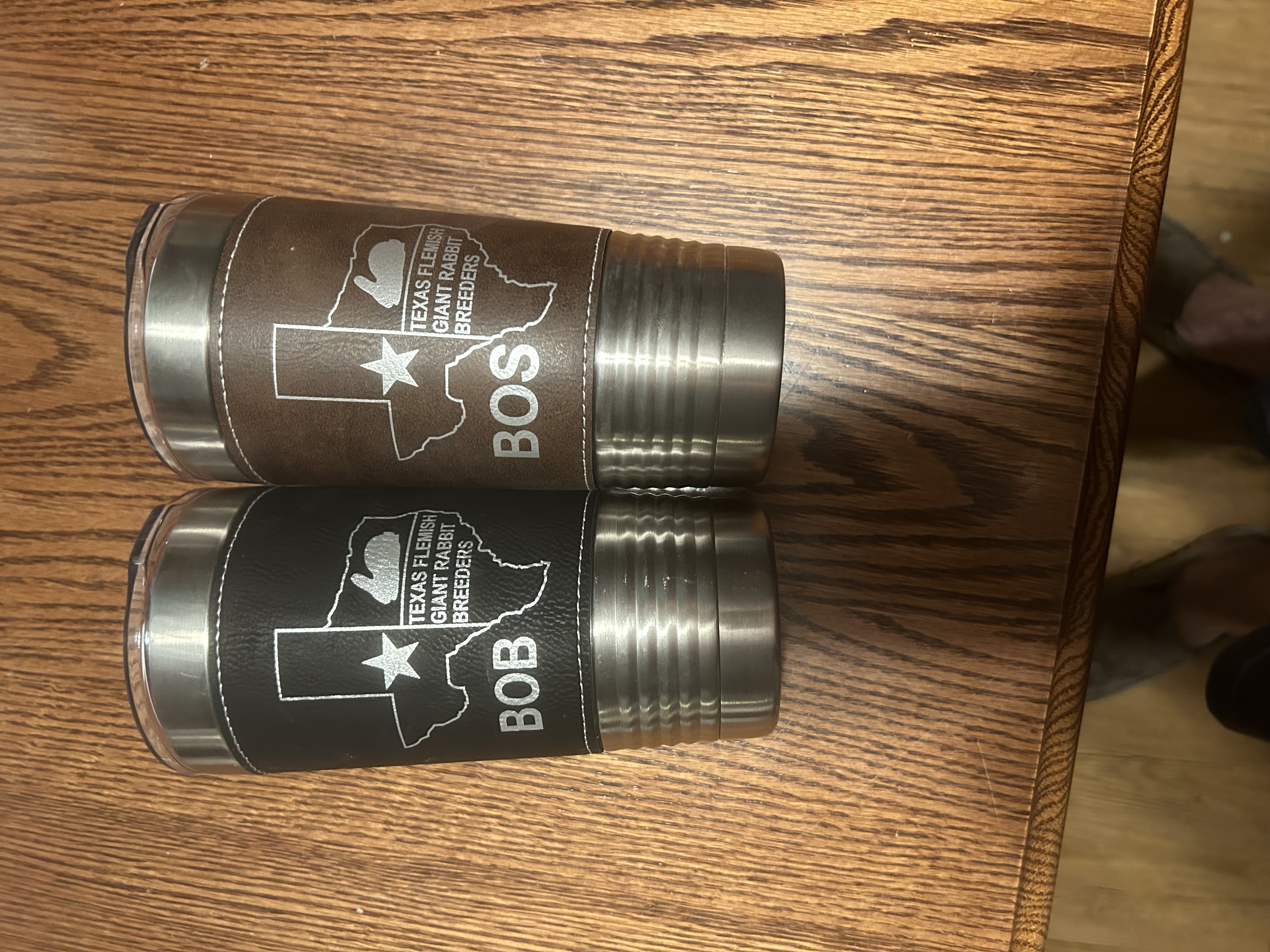 Two engraved stainless steel tumblers with Texas Flemish Giant Rabbit Breeders logos