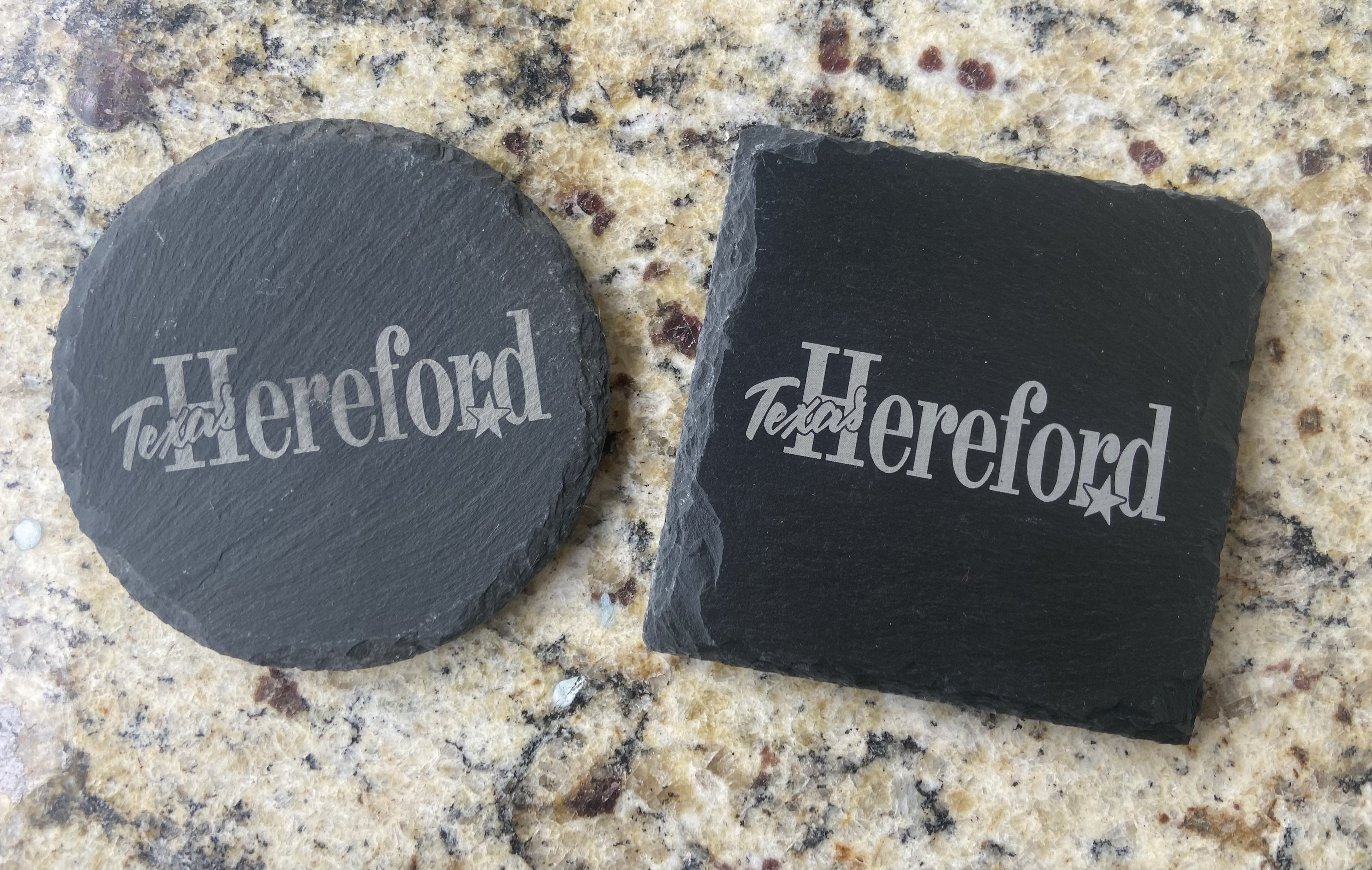 Two engraved slate coasters with Texas Hereford design